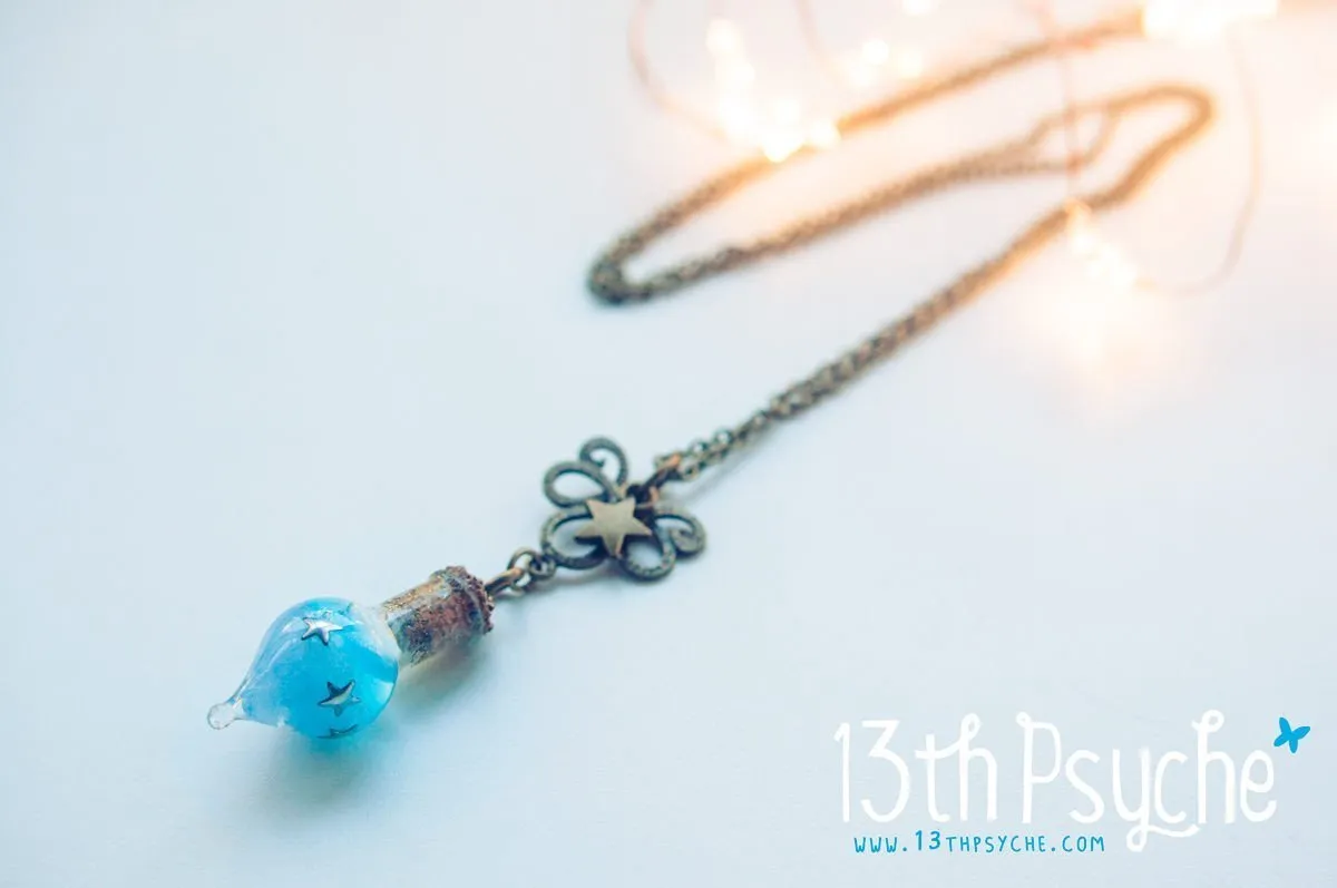 Glow in the dark blue teardrop vial pendant necklace