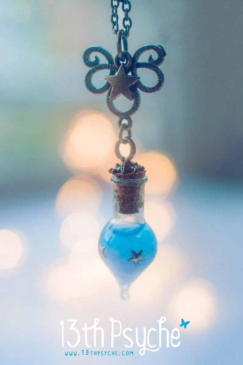 Glow in the dark blue teardrop vial pendant necklace