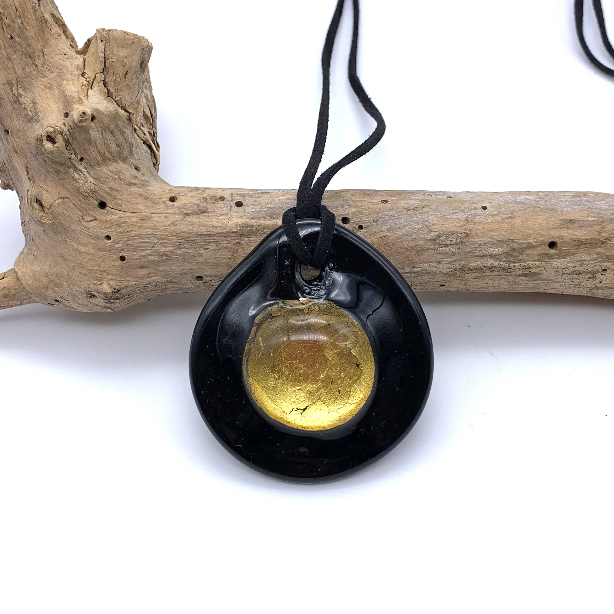 Necklace with clear crystal and gold on black Murano glass near circular large dome pendant