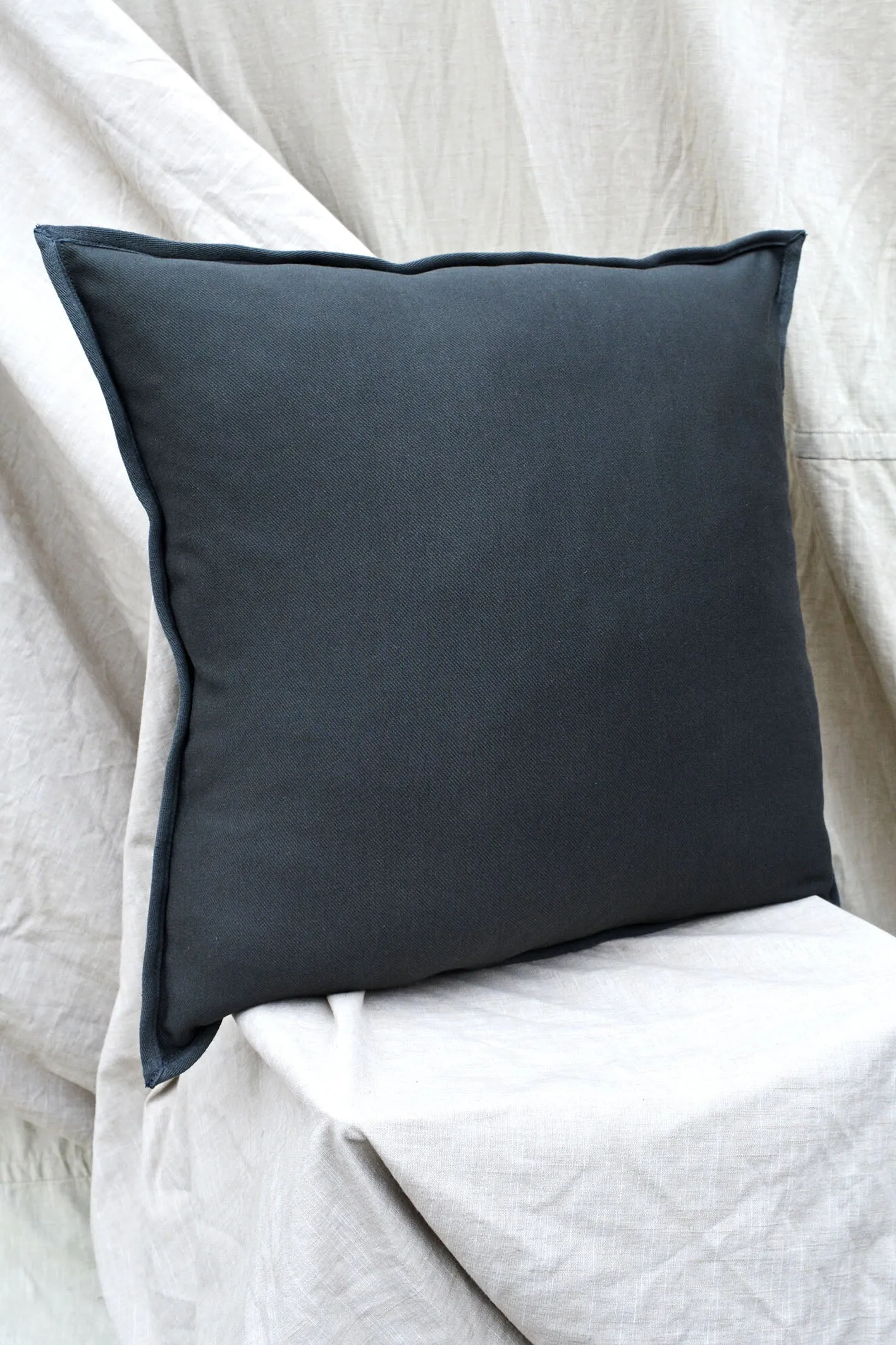 SQUARE APPLIQUE CUSHION - UMBER SANDSTONE